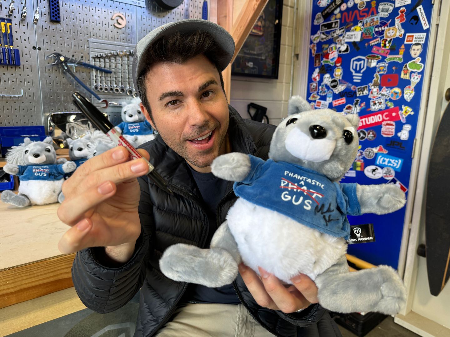 Photo of Mark Rober Signing a Phat Gus Plushie Toy