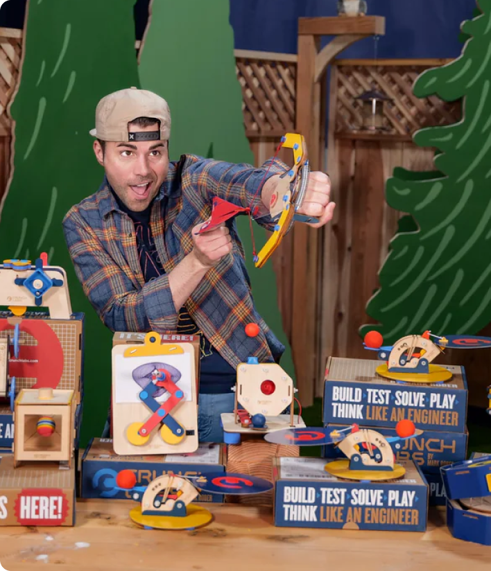 Photo of Mark Rober playing with all Build Boxes from Camp CrunchLabs