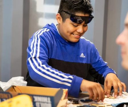 Photo of Boy Assemblng a CrunchLabs Box