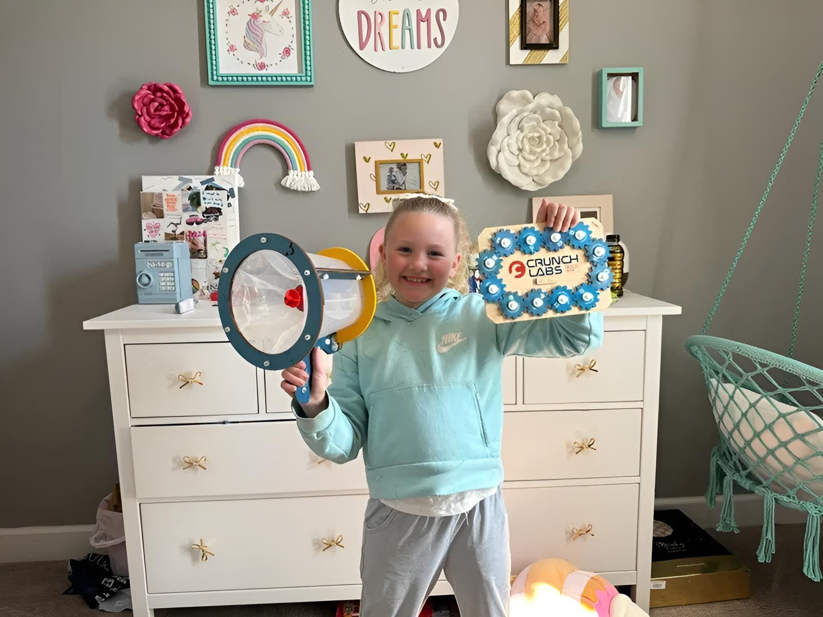 Photo of Girl Showing Off CrunchLabs Diploma